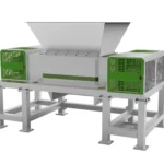 A shear-type double-shaft shredder with a sturdy industrial design. The machine features a large feed hopper at the top for easy loading of materials. It has two robust cutting shafts housed within a solid frame, and the sides are covered with green protective grilles. This shredder is designed for efficient and effective processing of various materials, making it ideal for industrial recycling and waste management applications. The machine’s construction emphasizes durability, safety, and high performance.