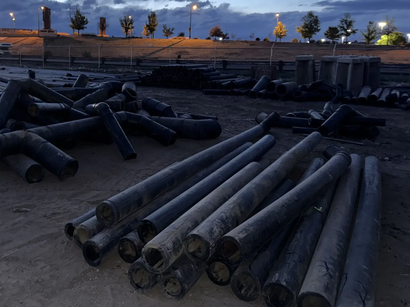 Large plastic pipes prepared for mobile shredding