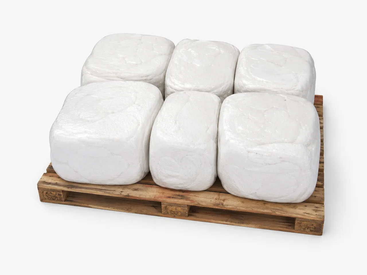 Densified EPS foam blocks stacked on a pallet after hot-melt recycling