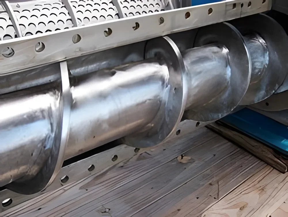 Perforated casing section for screw press water drainage